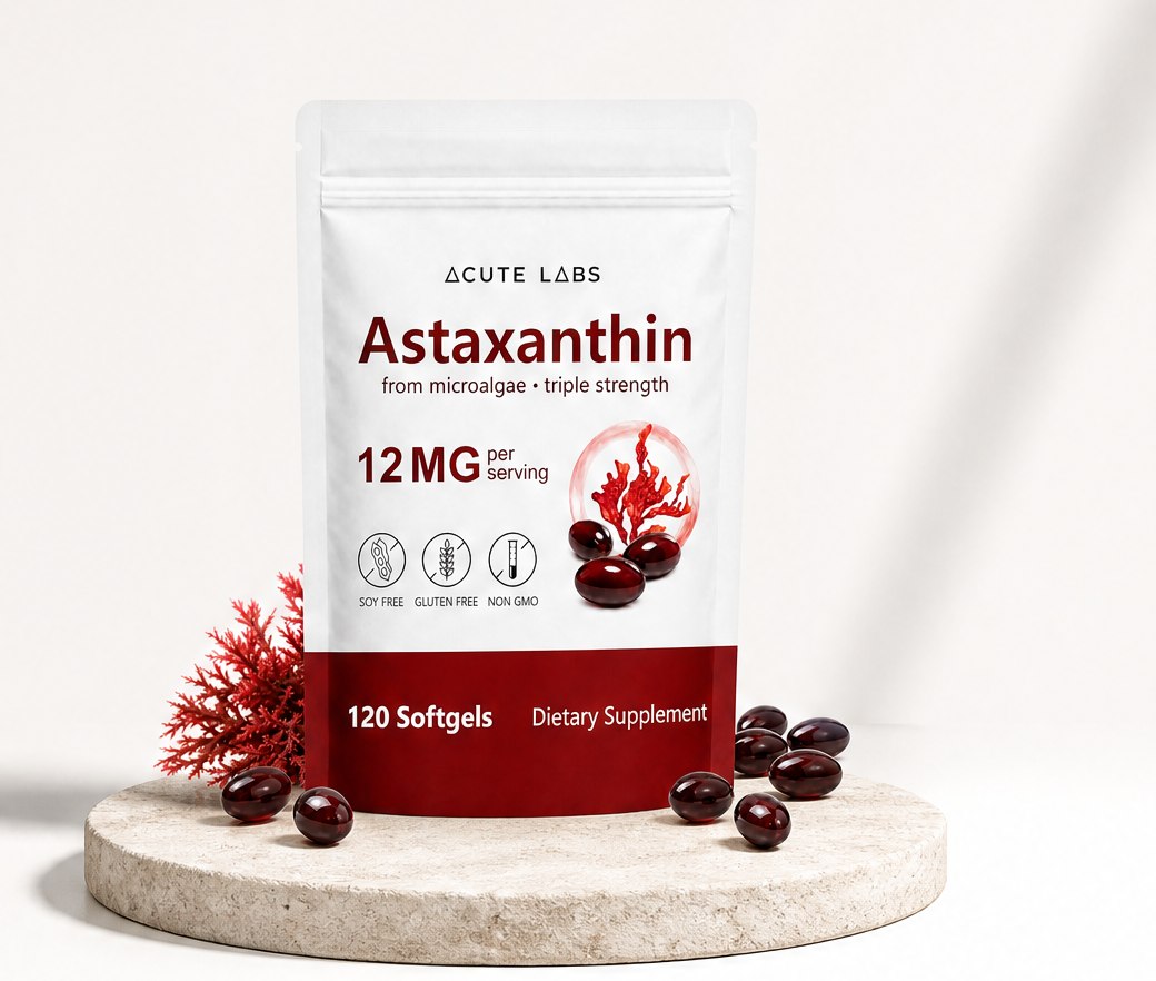 Acute Labs Astaxanthin pouch on a stone plinth with red softgels
